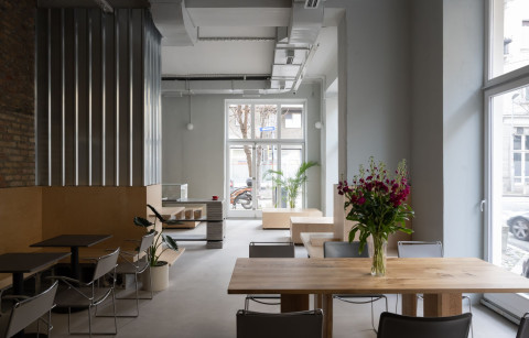 Brutalist interior details and metal wall panels at Chernyi Cooperative Coffee Roasters