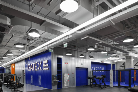 Wide view of a blue-toned functional room at Gate-X Fitness Club