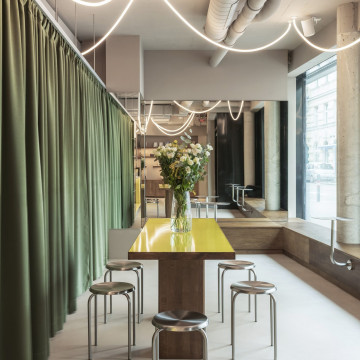 Loka Yoga & Cafe interior with textured walls and warm seating