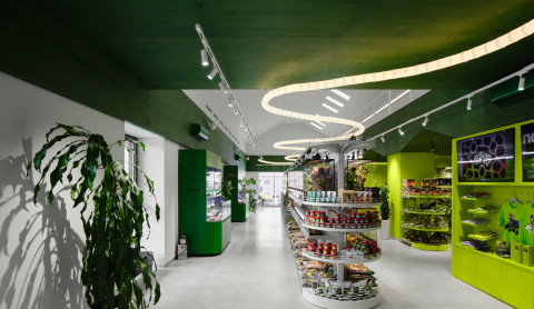 Final room view of Panteric with jungle-like retail atmosphere and dark display cases