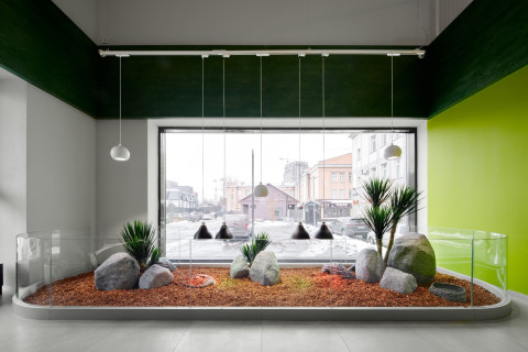 Panteric retail counter area with natural textures and dark display elements
