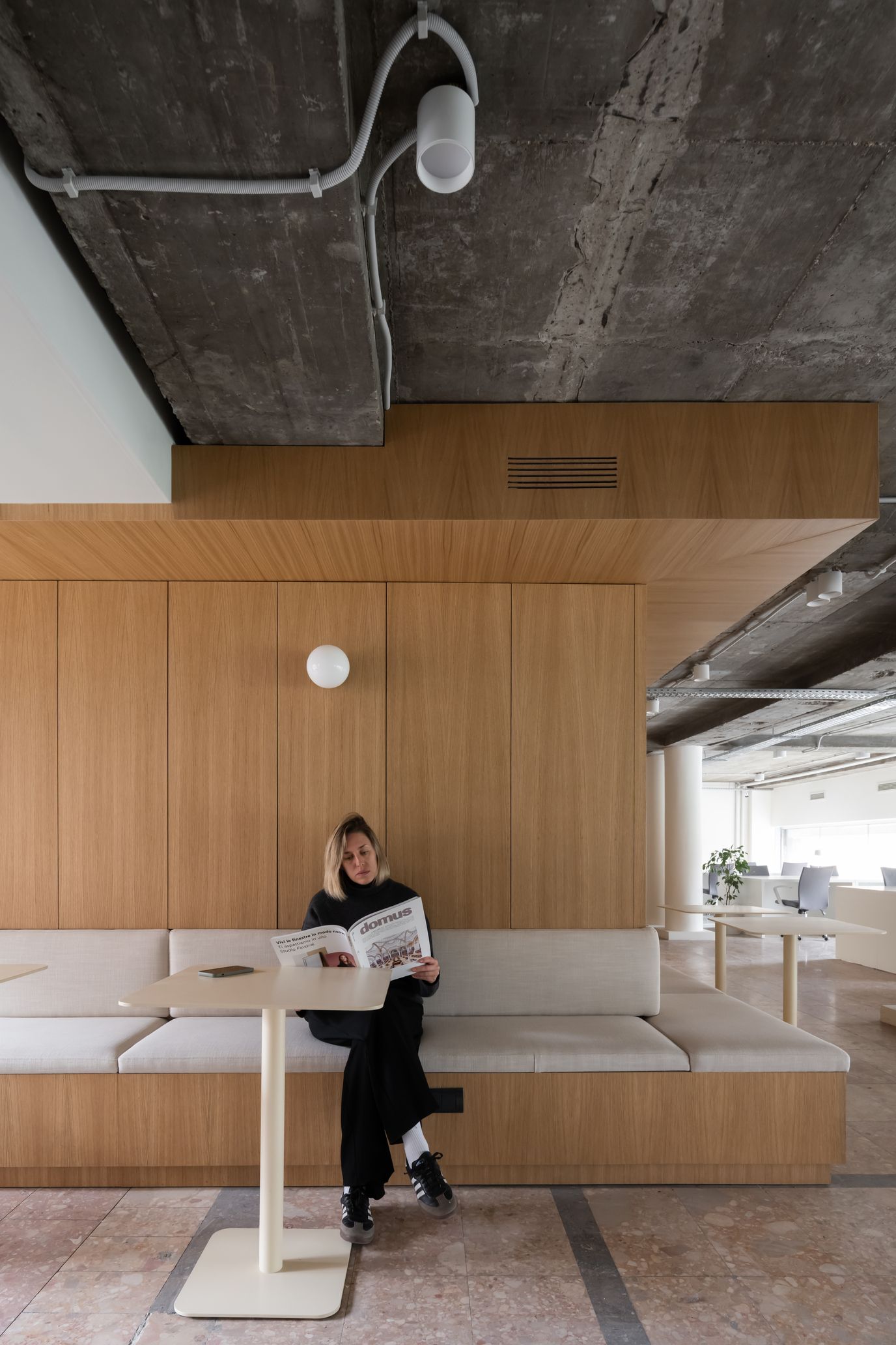 PFU Coworking vertical interior view with oak furniture, desk lamps and warm office atmosphere