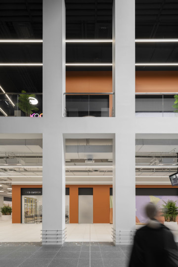 Siesta Shopping Center retail interior with terracotta tones and vertical gallery view