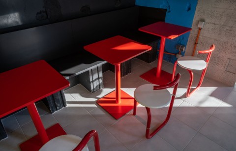 TT-Eatery dining counter with red stools, blue wall and yellow accents